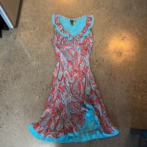 BCBG midi length sleeveless dress, ruffle accent and side slit